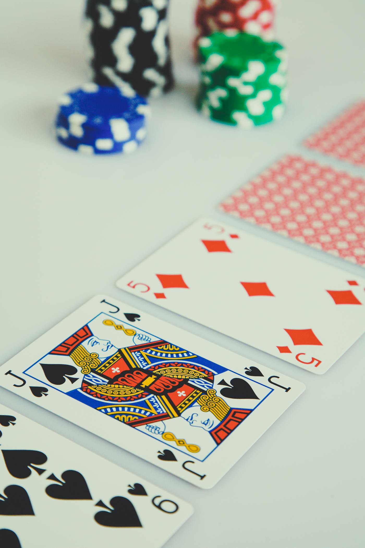 Stacked casino chips — $50 no deposit bonus plus 100 free spins at slots madness